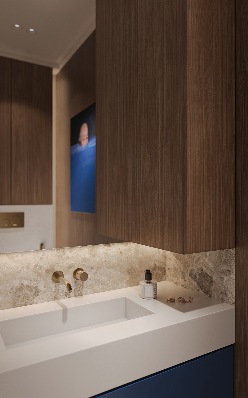 Stone basin and walnut cabinetry detail