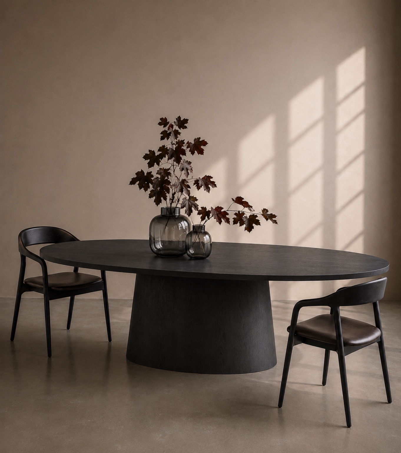 Dark oval dining table in a warm interior setting